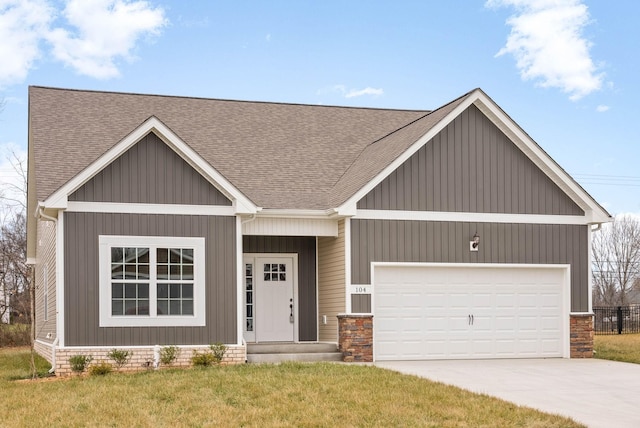 view of front facade with a garage and a front yard