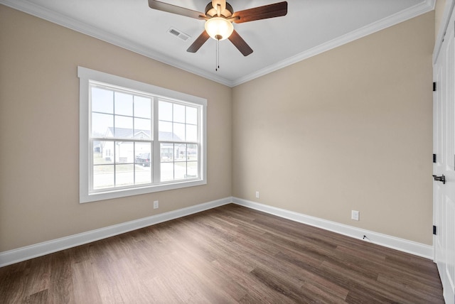 empty room with dark hardwood / wood-style flooring, crown molding, and ceiling fan