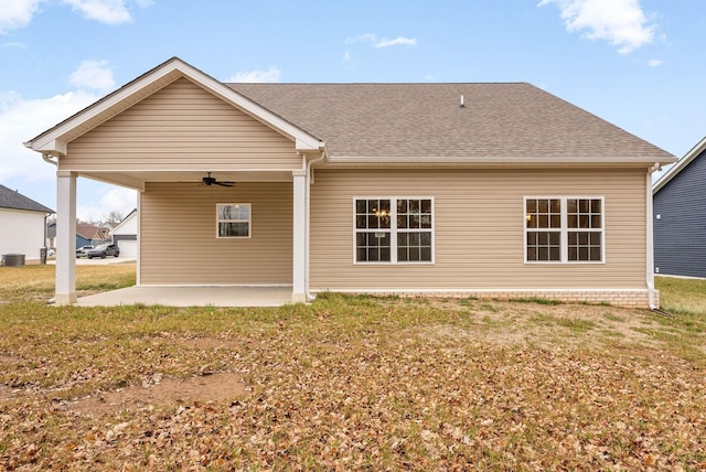 back of property featuring a yard, central air condition unit, ceiling fan, and a patio area