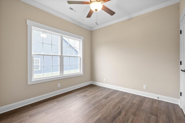 spare room with dark hardwood / wood-style flooring, ornamental molding, and ceiling fan