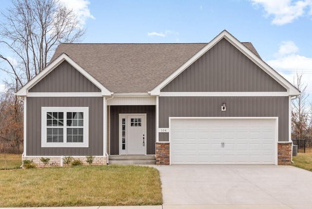 view of front of home with a garage and a front yard