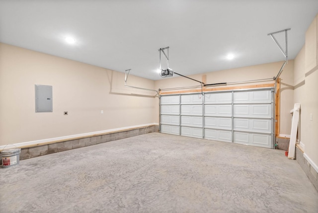 garage with a garage door opener and electric panel