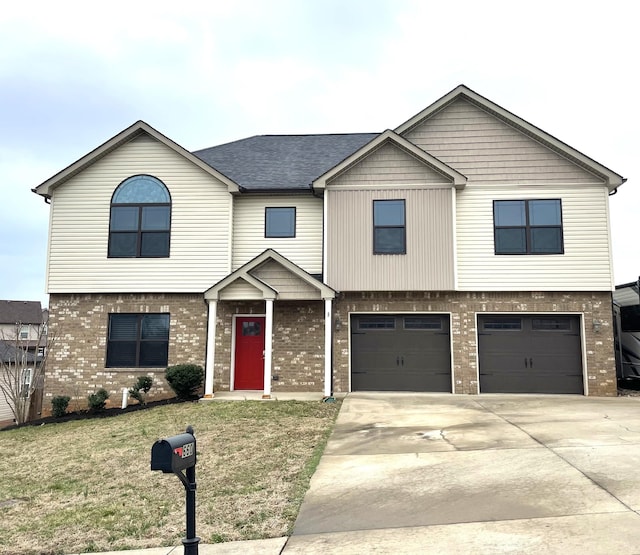 view of front of house featuring a garage and a front yard