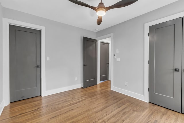 unfurnished bedroom featuring ceiling fan and light hardwood / wood-style floors