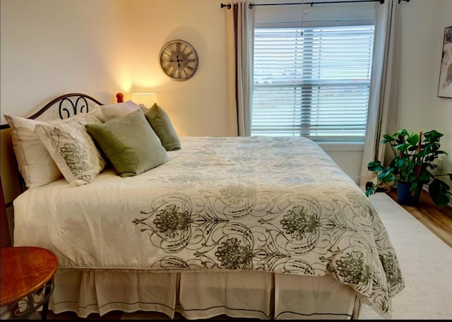 bedroom featuring wood-type flooring