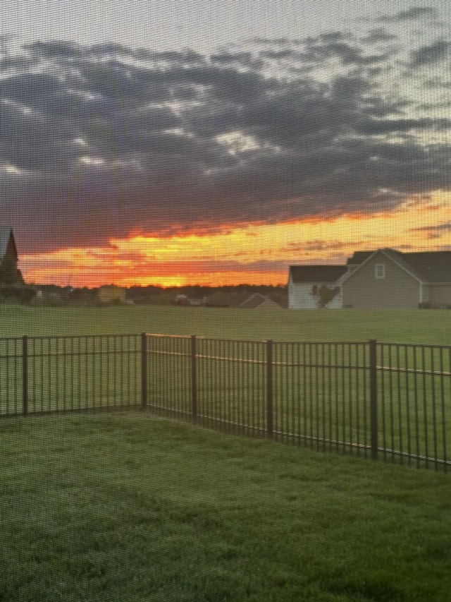 view of yard at dusk