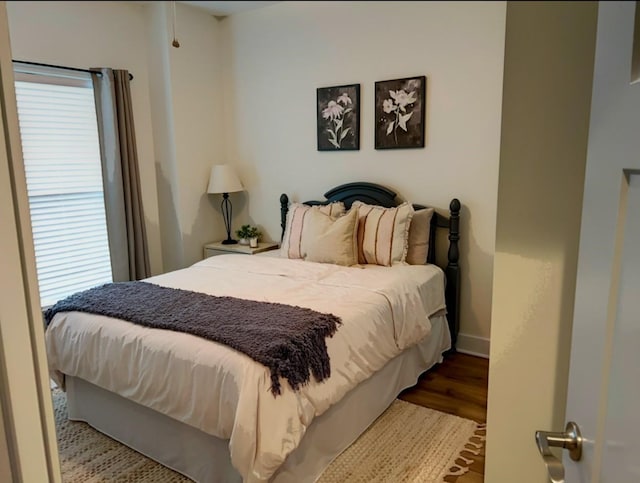 bedroom featuring wood-type flooring