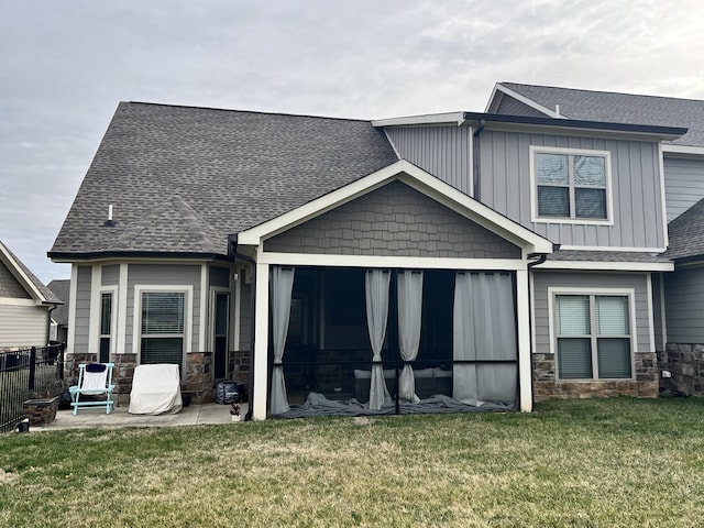 back of property featuring a lawn and a patio area