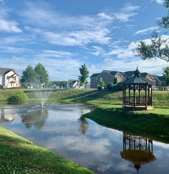 property view of water featuring a gazebo and a residential view
