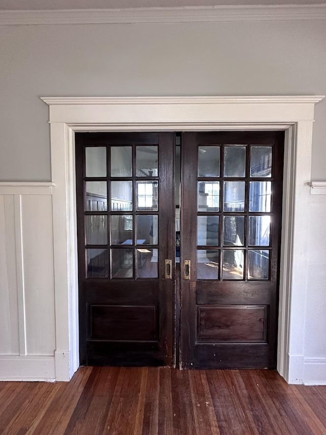 doorway to outside with crown molding and dark hardwood / wood-style floors