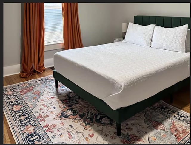 bedroom featuring wood-type flooring