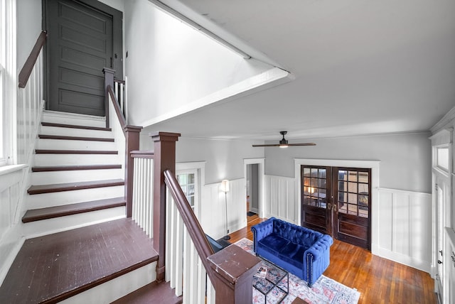 440 N 2nd St, Clarksville, TN 37040 - stairs with french doors, wainscoting, wood finished floors, a decorative wall, and crown molding