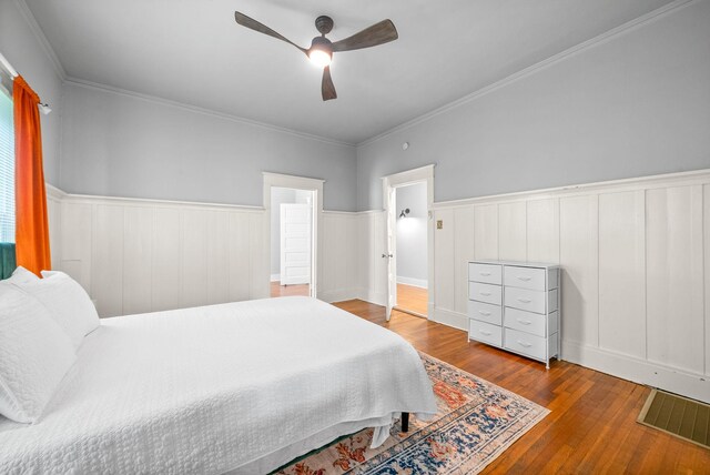 440 N 2nd St, Clarksville, TN 37040 - bedroom with hardwood / wood-style floors, wainscoting, ceiling fan, and crown molding
