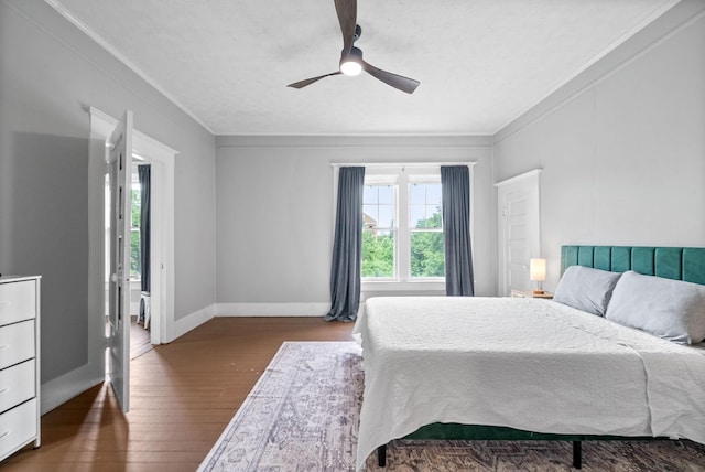 440 N 2nd St, Clarksville, TN 37040 - bedroom with multiple windows, ornamental molding, dark wood-style flooring, baseboards, and a ceiling fan