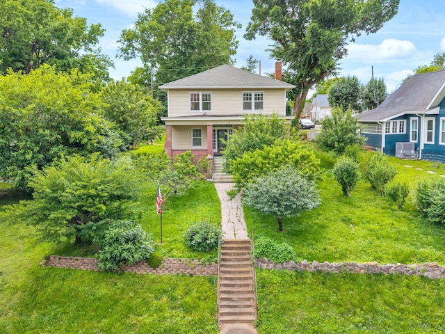 440 N 2nd St, Clarksville, TN 37040 - american foursquare style home featuring stairs, a front yard, and a chimney