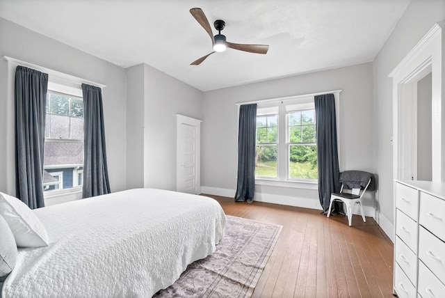 440 N 2nd St, Clarksville, TN 37040 - bedroom with wood-type flooring, baseboards, and a ceiling fan