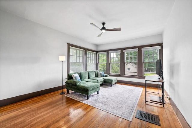 440 N 2nd St, Clarksville, TN 37040 - living area featuring a ceiling fan, baseboards, and hardwood / wood-style floors