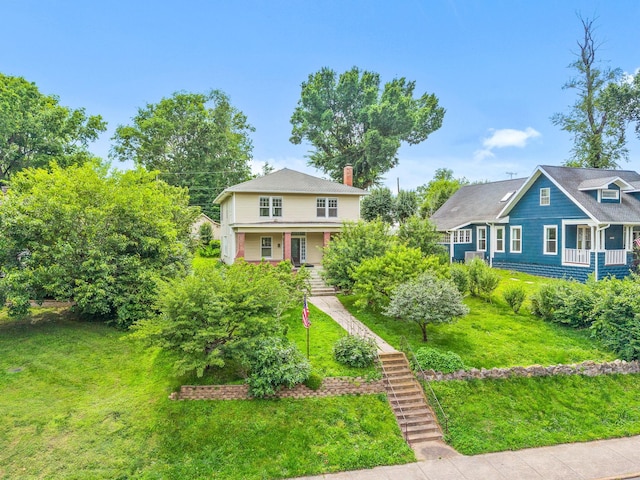 440 N 2nd St, Clarksville, TN 37040 - view of front facade with stairs, a porch, a chimney, and a front yard