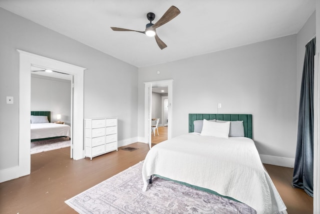 440 N 2nd St, Clarksville, TN 37040 - bedroom with wood finished floors, ceiling fan, and baseboards