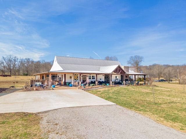 view of front of house with a front yard and covered porch