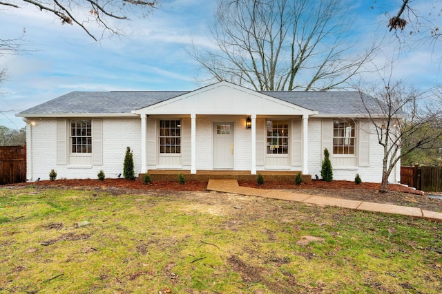 ranch-style home with a front lawn