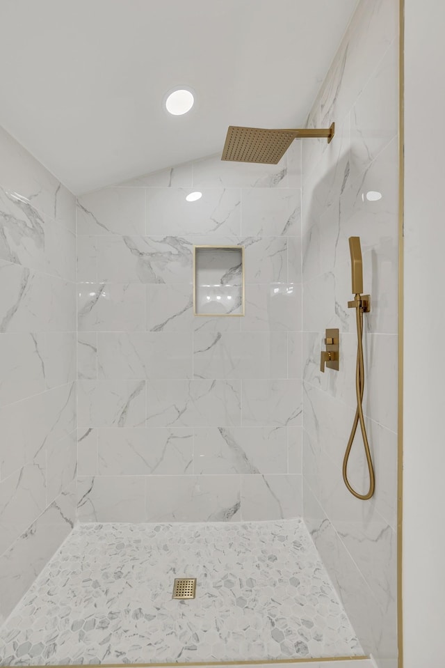 bathroom with a tile shower