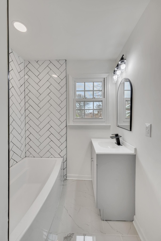 bathroom featuring vanity and tiled shower / bath combo