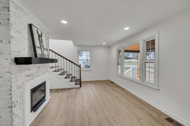 unfurnished living room featuring light hardwood / wood-style floors