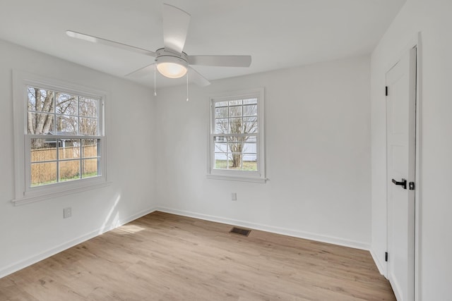 unfurnished room with light hardwood / wood-style flooring and ceiling fan