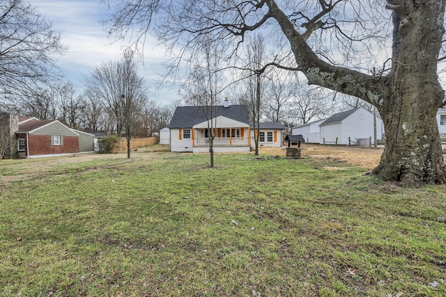 view of front of house featuring a front yard and covered porch