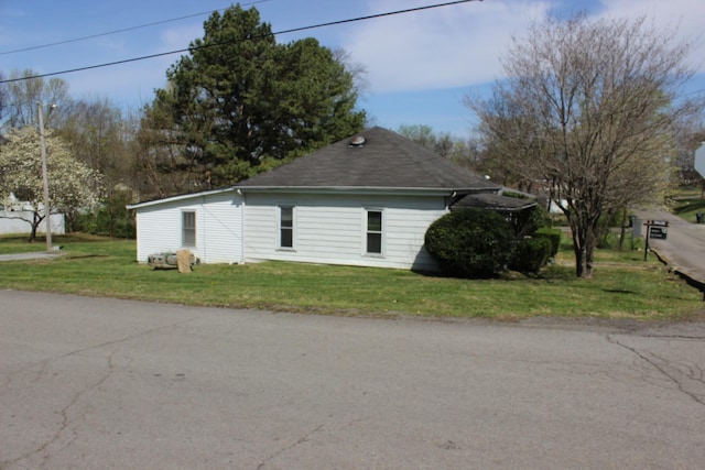 view of property exterior featuring a yard