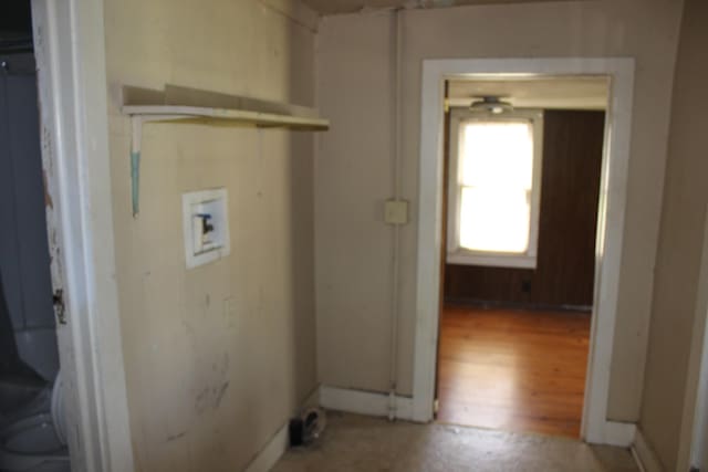clothes washing area featuring hookup for a washing machine and laundry area
