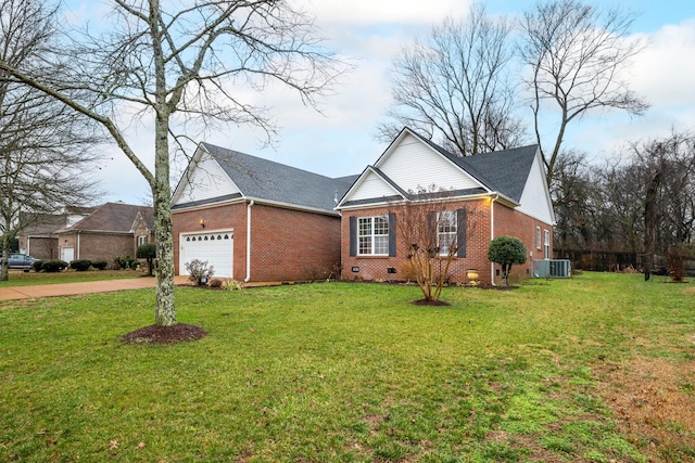 view of front of home with a garage, a front yard, and central air condition unit