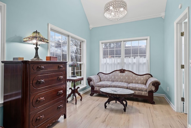 sitting room featuring light hardwood / wood-style flooring, plenty of natural light, and ornamental molding