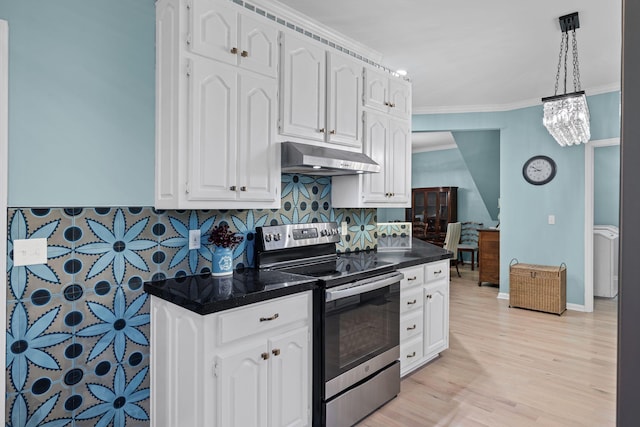 kitchen with decorative light fixtures, white cabinets, backsplash, electric range, and crown molding