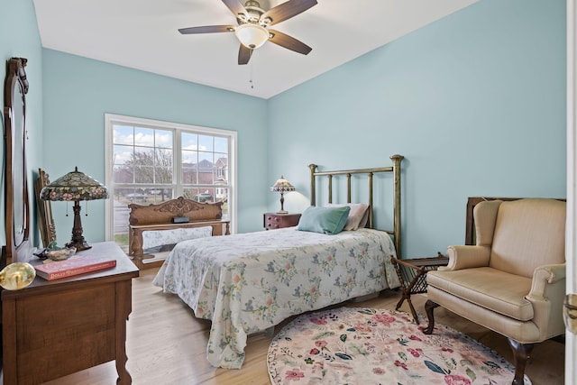 bedroom with ceiling fan and light wood-type flooring