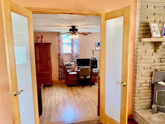 office area with hardwood / wood-style flooring and ceiling fan