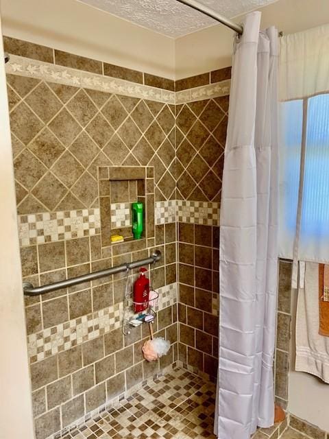 bathroom featuring a textured ceiling and walk in shower