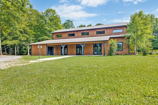 view of front facade featuring french doors and a front yard