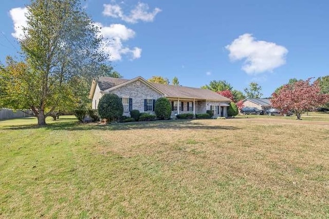 ranch-style home with a front yard