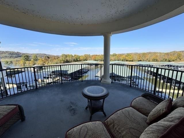 balcony featuring a water view