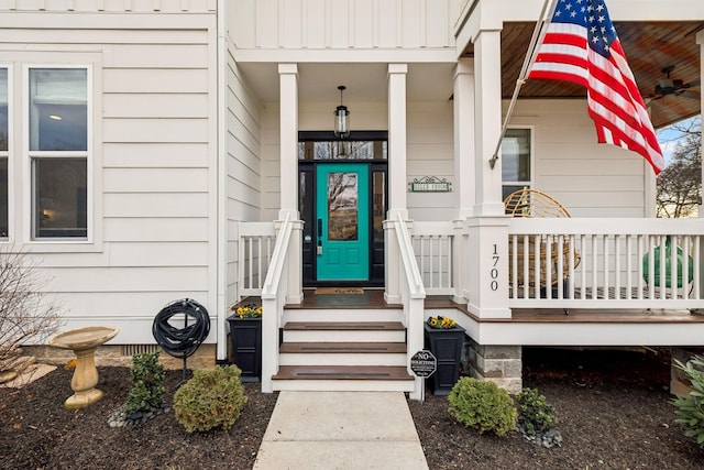 entrance to property featuring ceiling fan