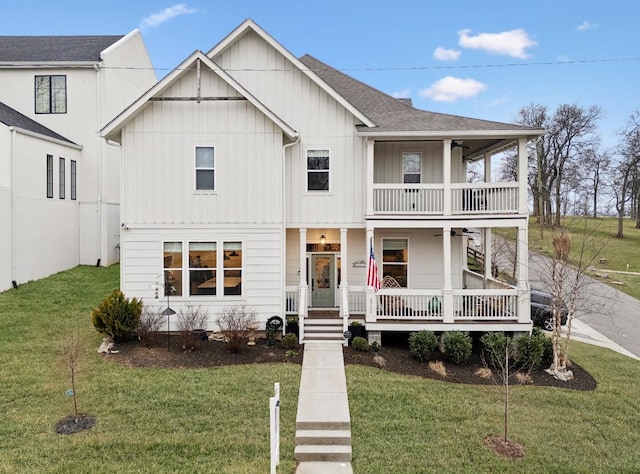 view of front of property featuring a front lawn, a porch, roof with shingles, a balcony, and ceiling fan