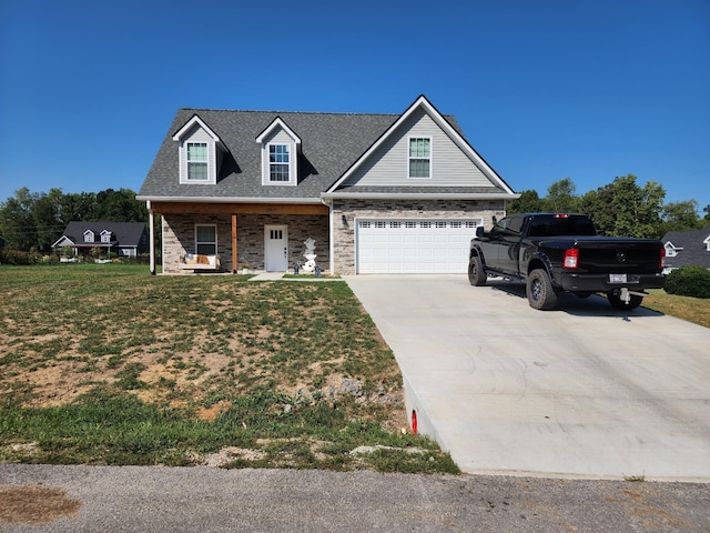 view of front of house featuring a garage, covered porch, and a front lawn