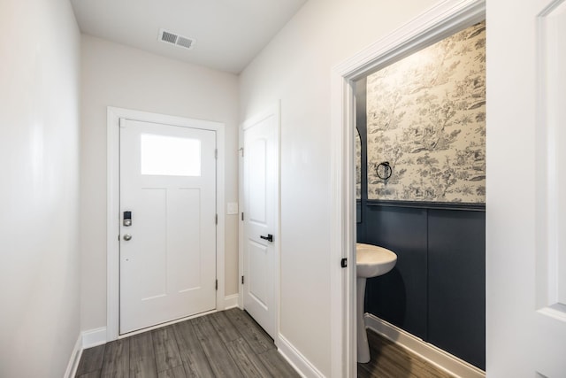 doorway with dark hardwood / wood-style floors