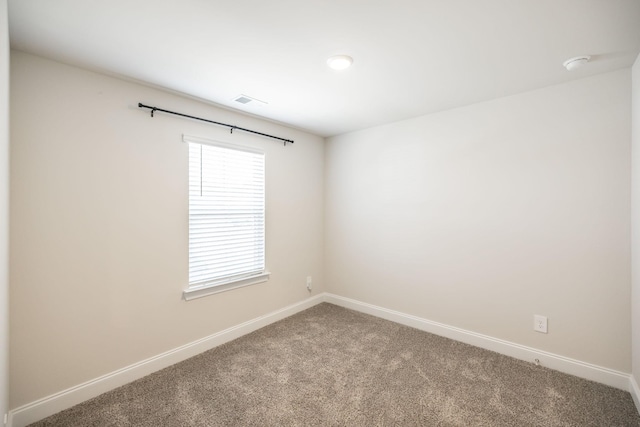 spare room with carpet flooring