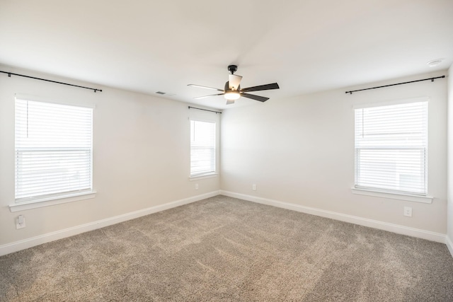 unfurnished room featuring carpet floors and ceiling fan