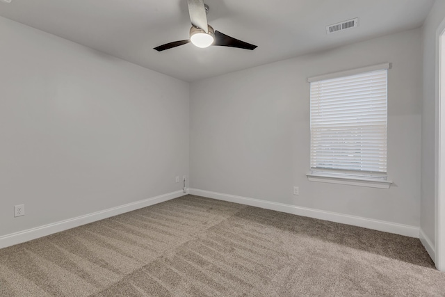 carpeted empty room featuring ceiling fan