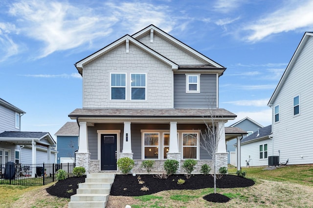 craftsman-style house featuring cooling unit and covered porch