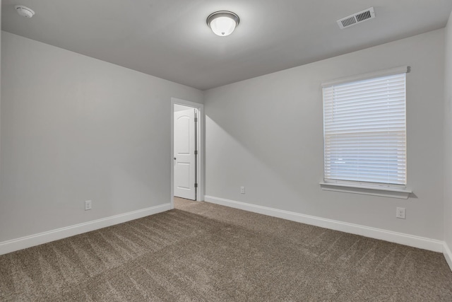 empty room featuring carpet floors